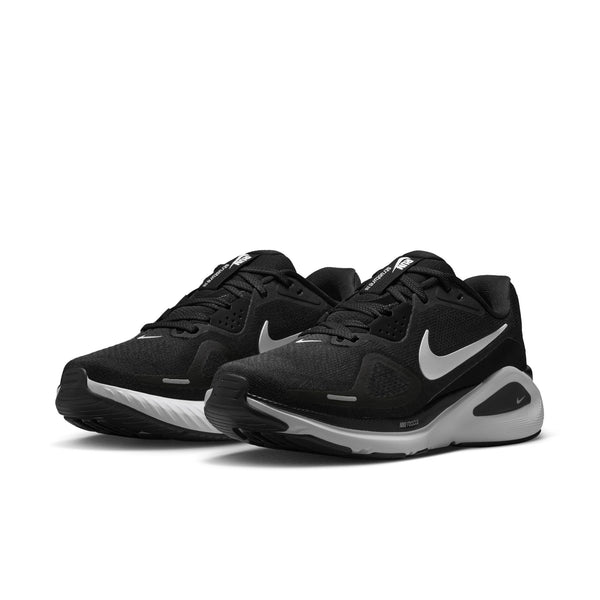 Black athletic shoes with a white logo on a white background.