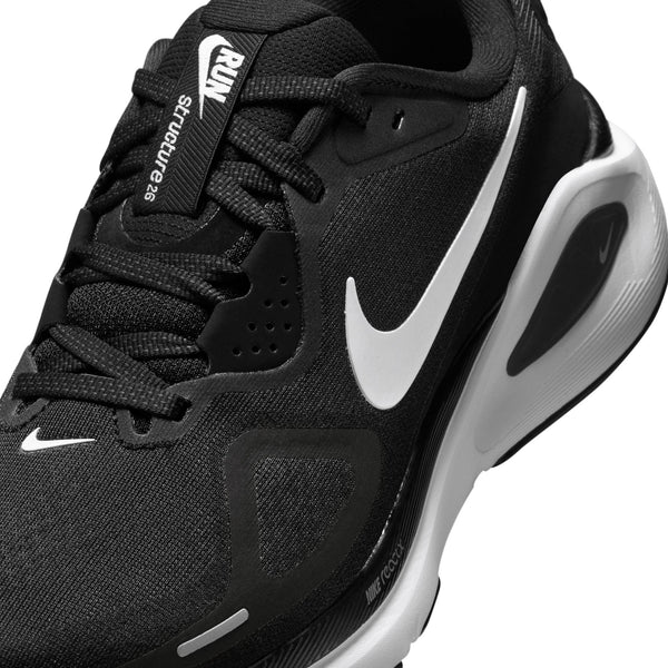 Black running shoe with white Nike logo on a white background.