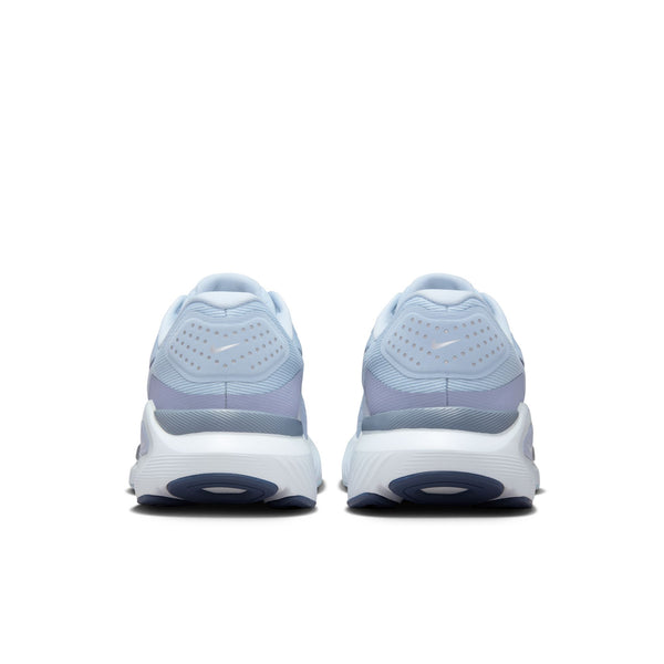 Medial side of a lght blue running shoe with Nike logo on a white background.