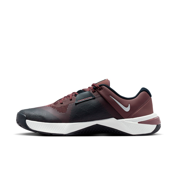 Maroon and black athletic shoe with white sole on a white background