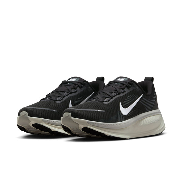 A pair of black Nike Vomero 18 running shoes with a white Nike logo on a white background.
