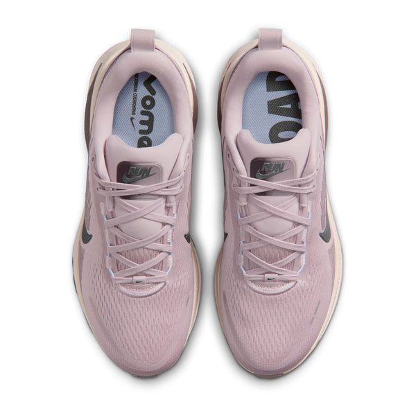 A pair of Women's Vomero 18 with a tab on the tongue that says "RUN"