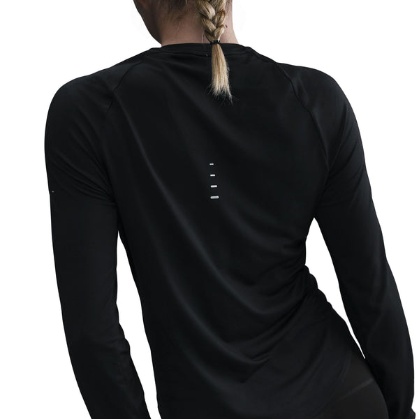 Black long-sleeve athletic shirt worn by a person on a white background