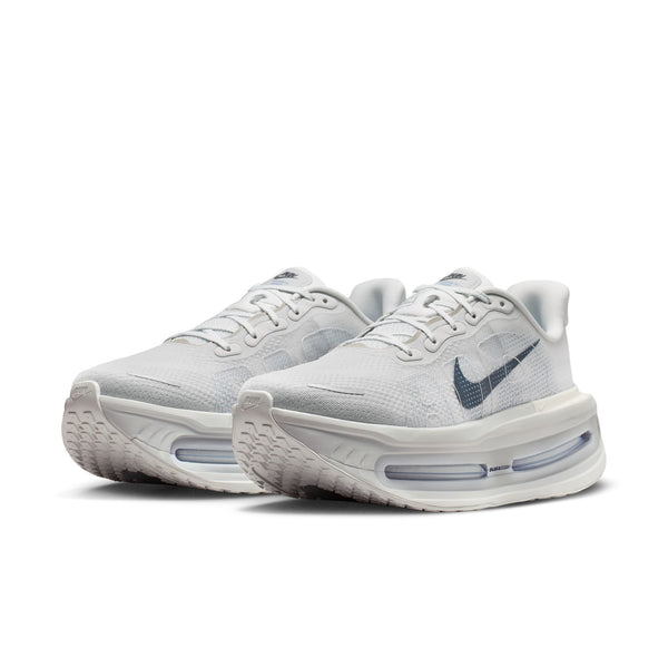 White running shoes with Nike logo on a white background
