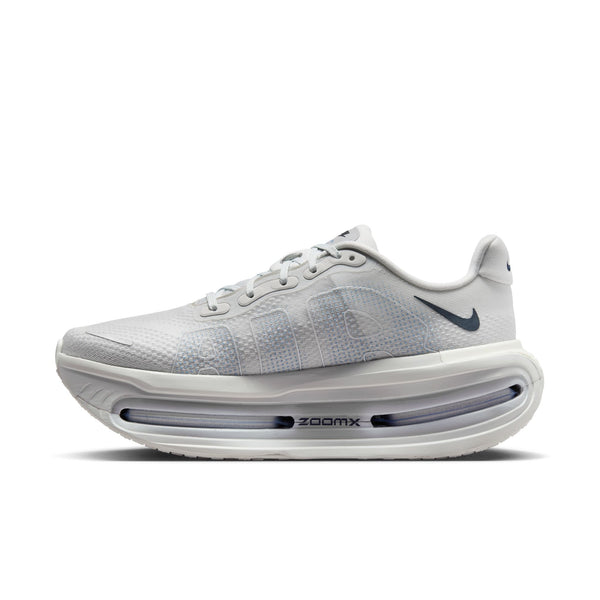 White running shoe with 'ZoomX' sole on a white background