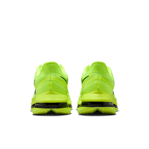 Pair of bright green running shoes on a white background