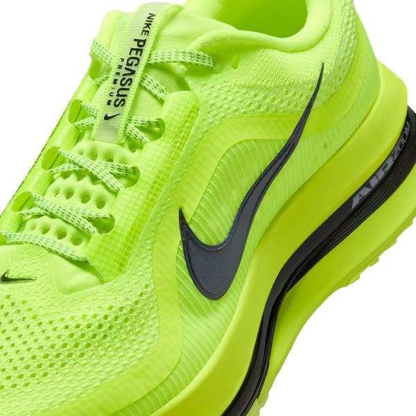 Bright green running shoe with black swoosh logo on a white background