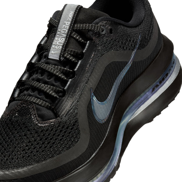 Black athletic shoe with blue accents on a white background