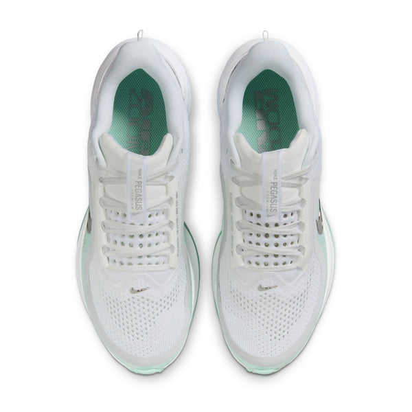 White sneakers with green accents on a white background.