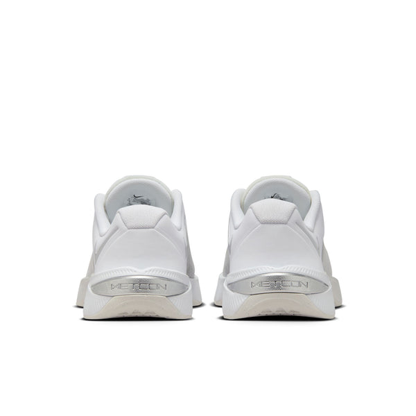 White athletic shoes with 'Nike' branding on a white background.