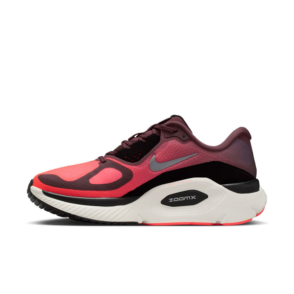 Red and black running shoe with Nike logo on a white background