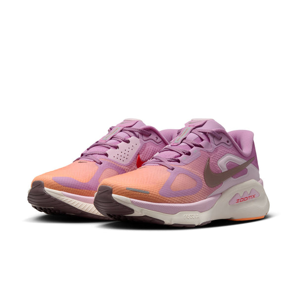 Pair of pink and orange running shoes on a white background