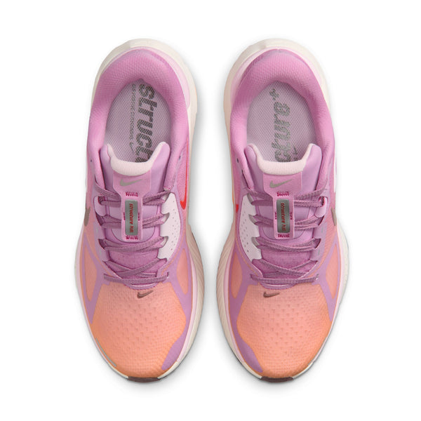 Pink and orange running shoes with visible brand logo on a white background