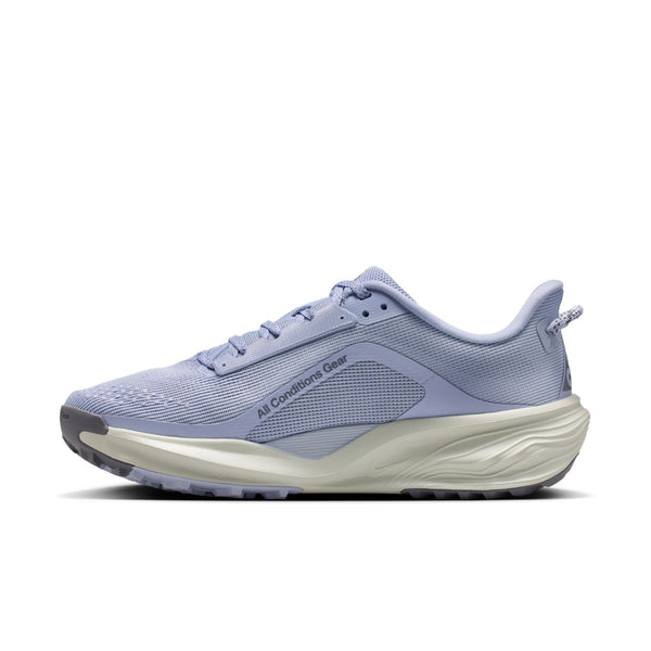 Purple running shoe with white sole on a white background