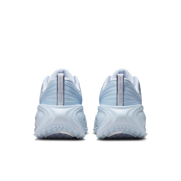The heel area of a light blue running shoes with white sole on a white background.
