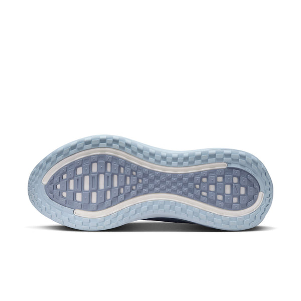 Close-up of a blue athletic shoe sole on a white background.