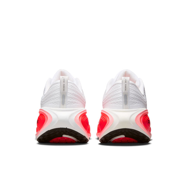 Heel area of a white running shoes with red accents on a white background.