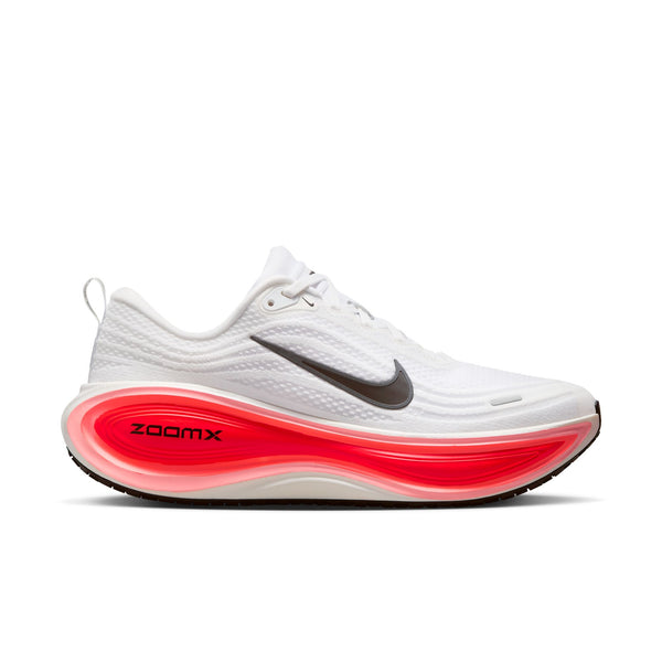 White running shoe with red sole on a white background.