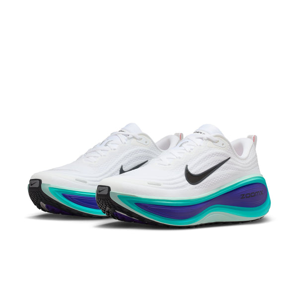 A pair of Nike Vomero Plus shoes facing at a diagonal angle to the left.