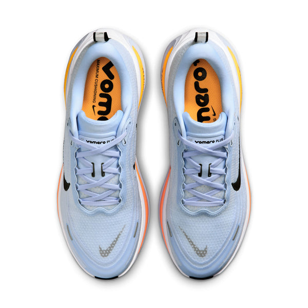 Light blue running shoes with orange accents on a white background