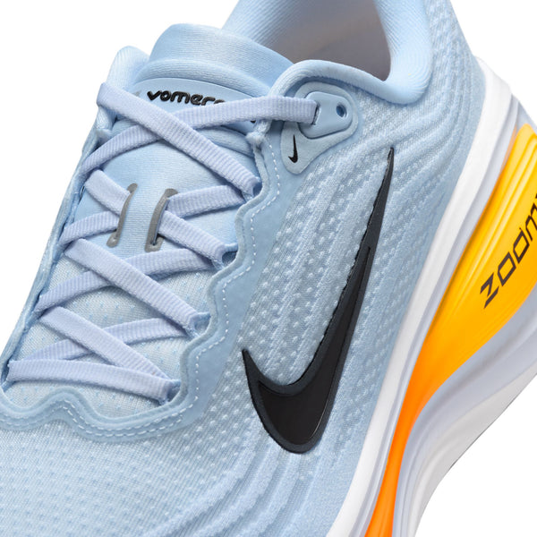 A cloeup of the upper of the Nike Vomero Plus with a light blue upper and matching laces.