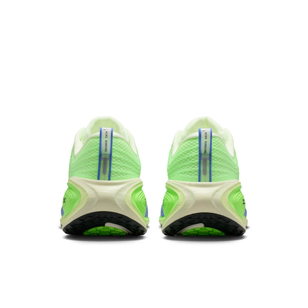 Green Nike athletic shoes with a white sole on a white background
