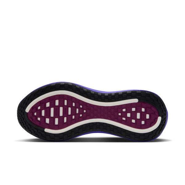 The outsole of this Nike Vomero Plus shows a purple color under most of the foot and black around the edges.