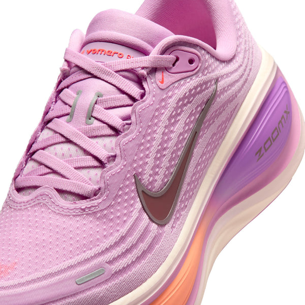 Pink running shoe with Nike logo on a white background