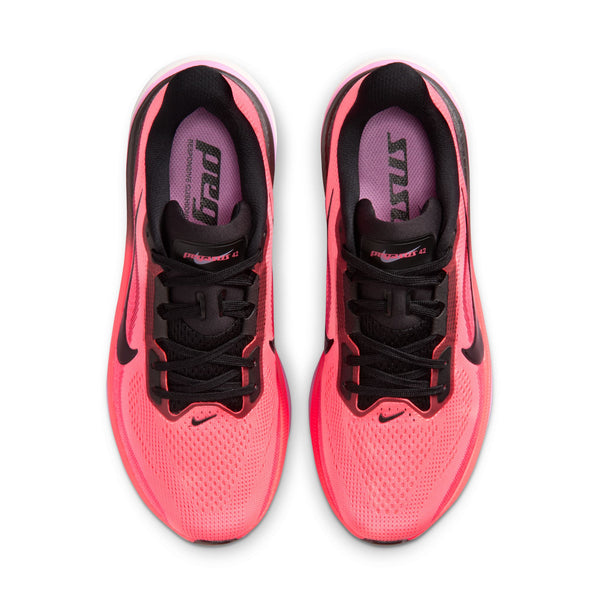 The top down look at a pink and black women's niek running shoe.