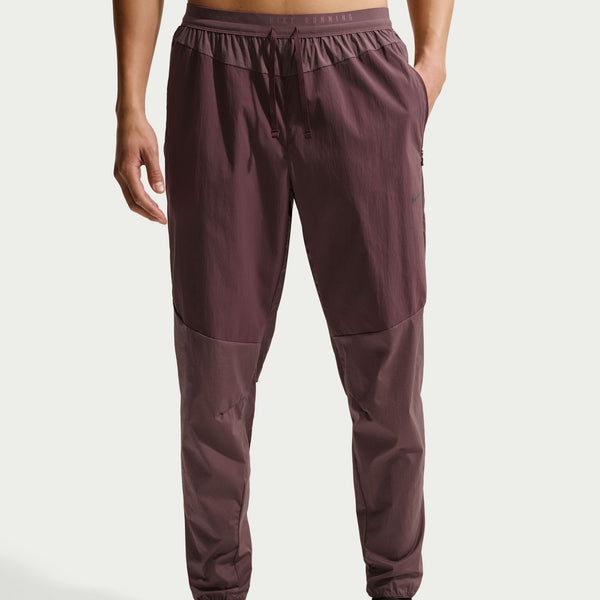 Maroon jogger pants on a white background