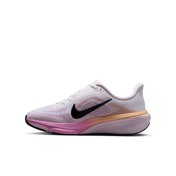 A Nike running shoe in white with a black Swoosh, featuring a pink and peach gradient midsole on a clean white background.