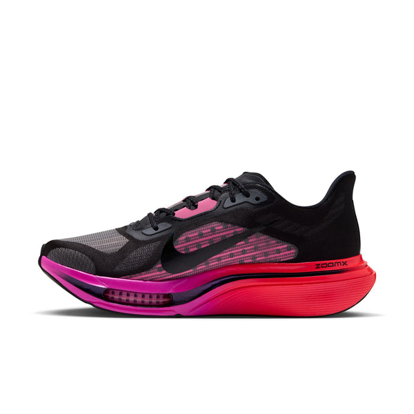 A Nike running shoe in black with vibrant pink and red accents on the midsole and upper, shown on a white background.