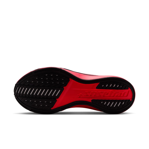 Red running shoe with black swoosh logo on a white background