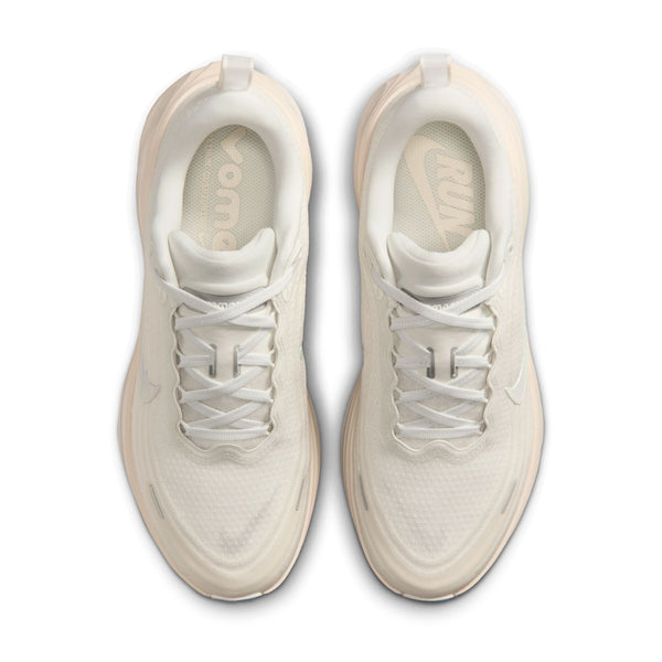 Pair of white sneakers on a light gray background