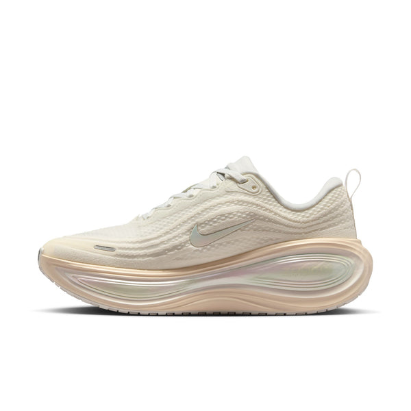 Beige running shoe with Nike logo on a white background