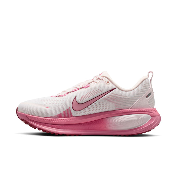 Pink and white running shoe on a white background