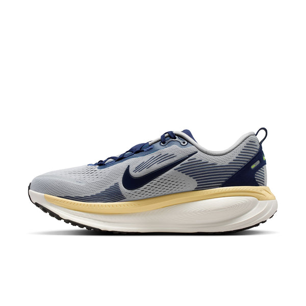 Gray and blue running shoe with a yellow sole on a white background