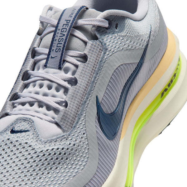 Gray running shoe with Nike logo and brand name on a white background