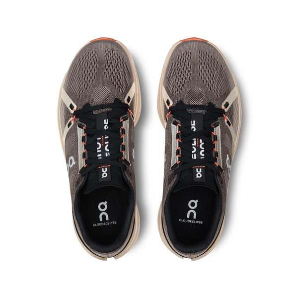 The Cloudeclise from On has a vertical fabric that runs over the top of the laces and says Cloudeclipse in broken letters