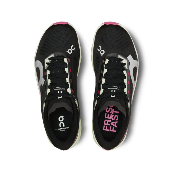 These running shoes are mostly all black, but the laces eyelets are a cream colorway.