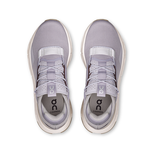 Pair of light purple sneakers with white soles on a white background.