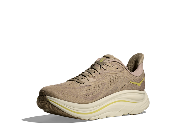 Beige and white running shoe on a white background