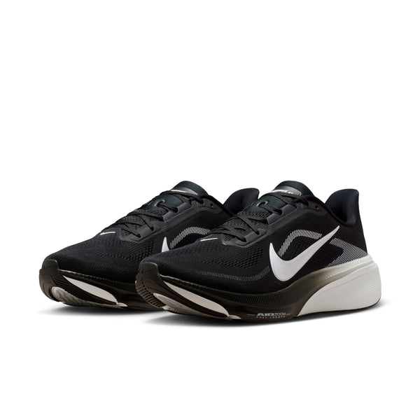 Black running shoes with white accents on a white background