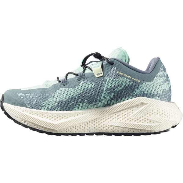 Teal and off-white gravel running shoe on a white background