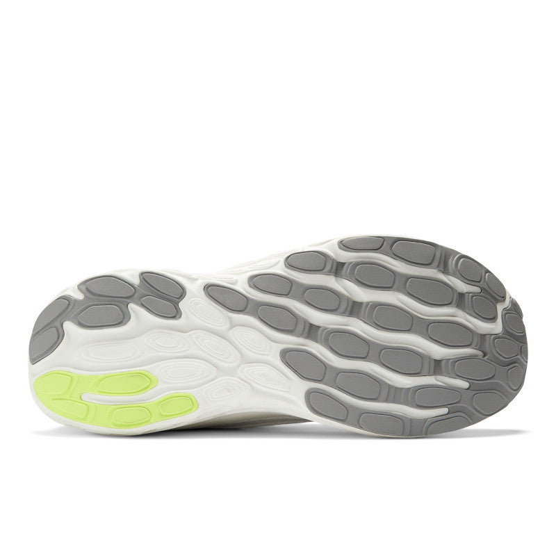 The outsole of this men's shoe is mostly all grey with a pop of green