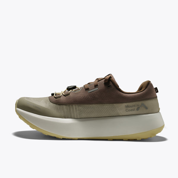 Mount to Coast featuring a brown and olive green upper, a thick cream-colored platform midsole, and a light tan outsole.