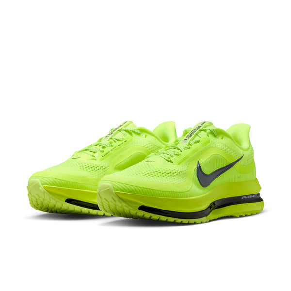 Bright green running shoes with Nike logo on a white background