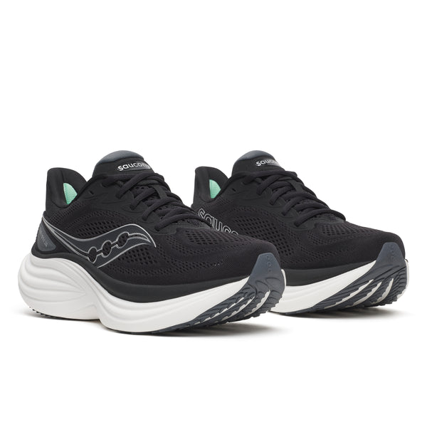 Black and white Women's Saucony Running shoes with white soles on a white backgrounds