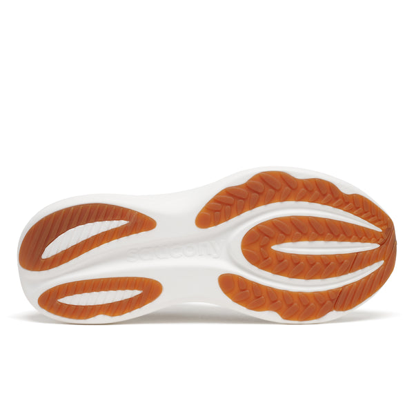 Close-up of a shoe sole with orange and white design on a white background