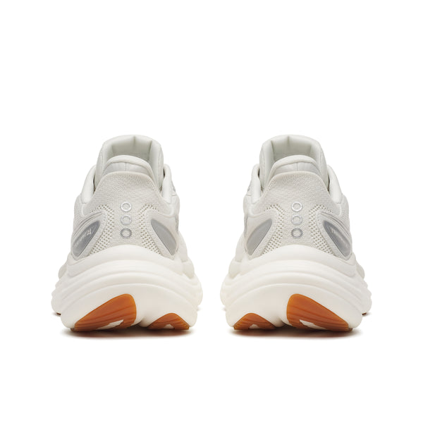 White sneakers with brown soles on a white background